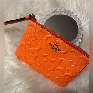 Coach Bright Orange Embossed Wristlet